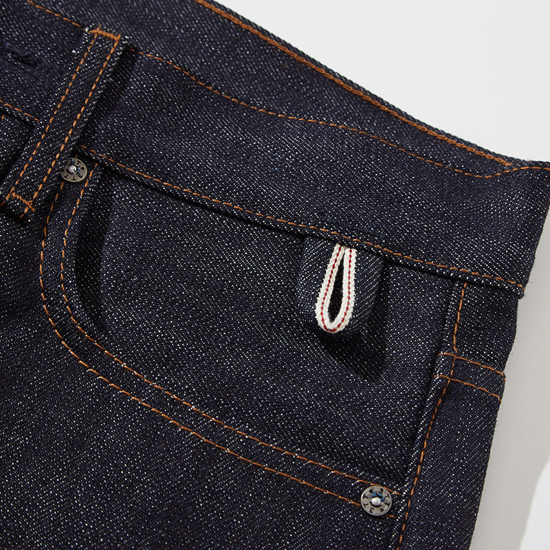 Close-up of the front pocket, rivets and striped selvedge keychain loop.