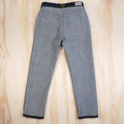 Inside back of OKONKWO jeans showing denim weave, seams and waistband