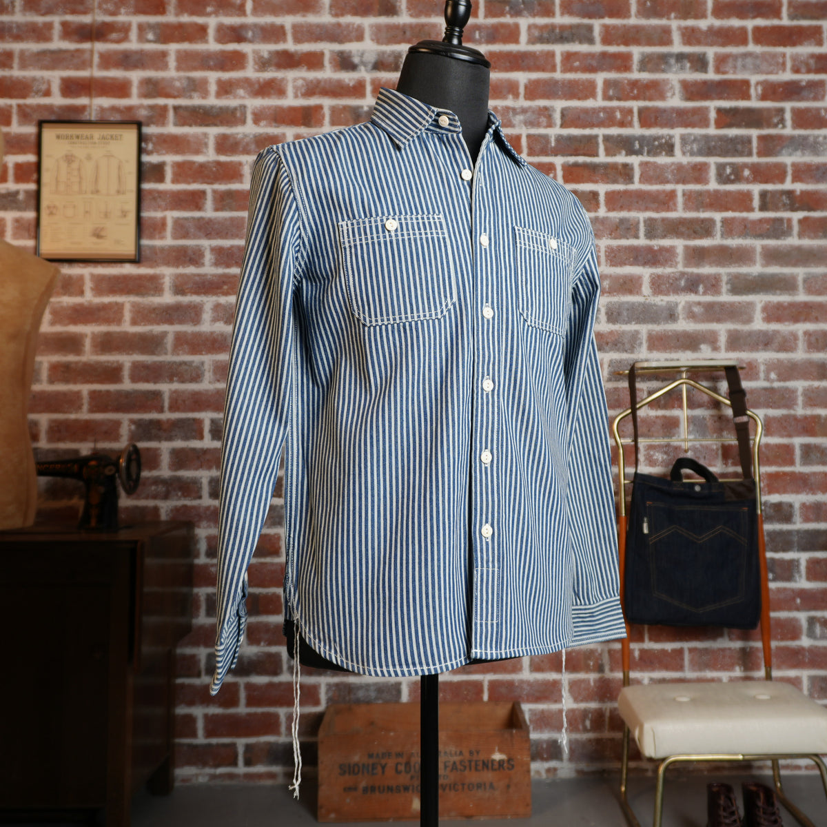 Front view of the blue and ecru hickory stripe cotton work shirt on a mannequin.